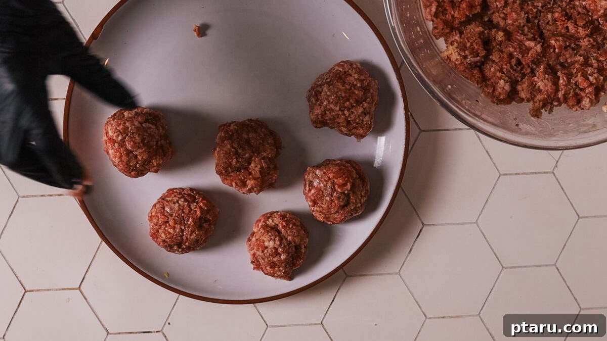 The Secret to Irresistible Meatballs 10 Shaping the meat mixture into uniform 2-inch meatballs.
