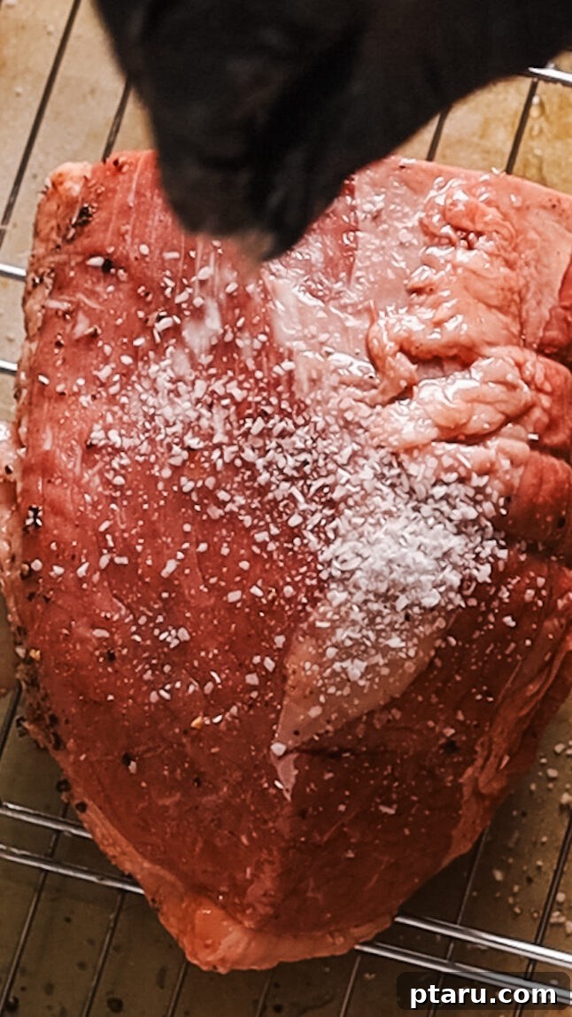 Hearty Dutch Oven Braised Beef 4 Seasoning a beef roast with salt and pepper before searing.