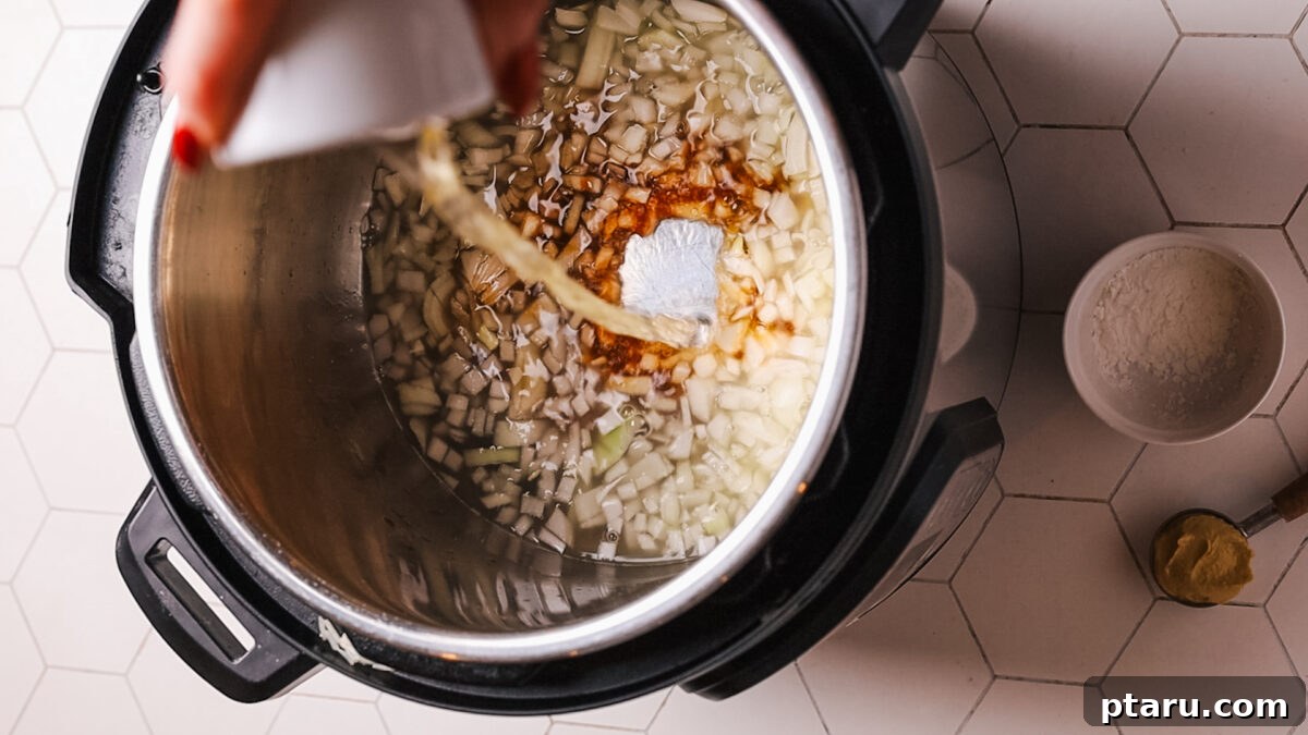 Fall-Apart Tender Instant Pot Pork Loin with an Irresistible Pan Sauce 7 adding onion and chicken broth