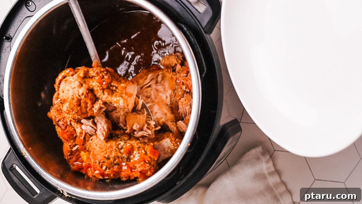 Fall-Apart Tender Instant Pot Pork Loin with an Irresistible Pan Sauce 9 removing pork