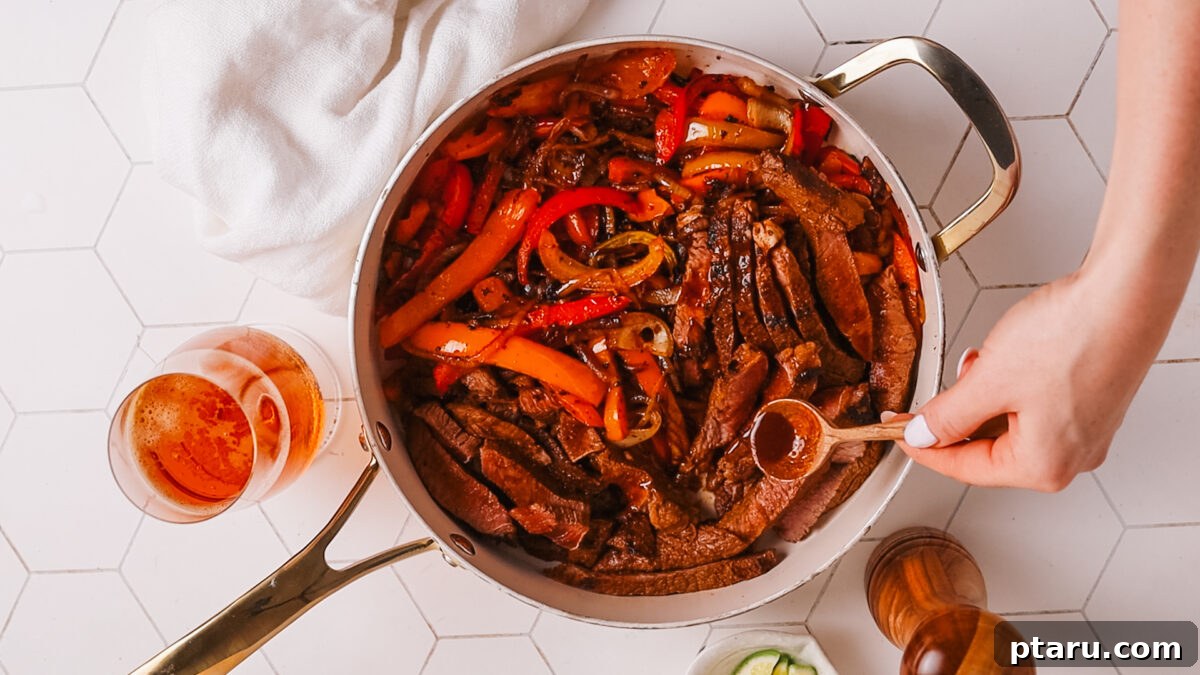 The Ultimate Recipe for Succulent Beef Fajitas 11 Assembled beef fajitas on a serving platter with warm tortillas and various toppings.