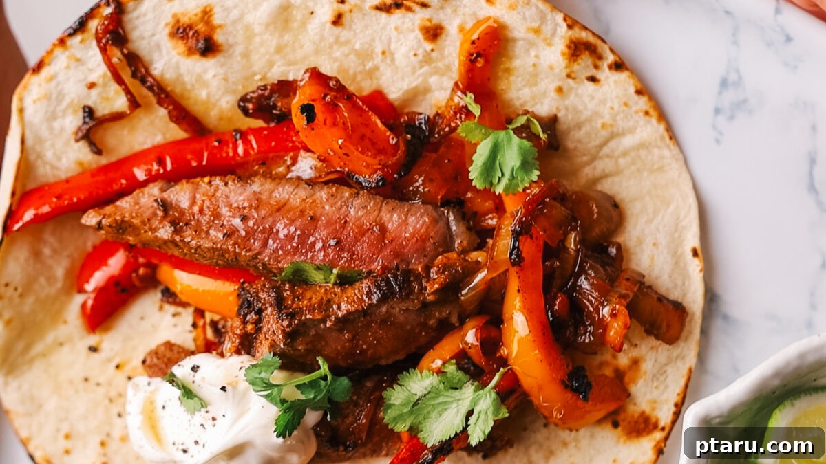The Ultimate Recipe for Succulent Beef Fajitas 12 Perfectly cooked beef fajitas served on warm tortillas with a variety of fresh toppings like sour cream, avocado, and lime.