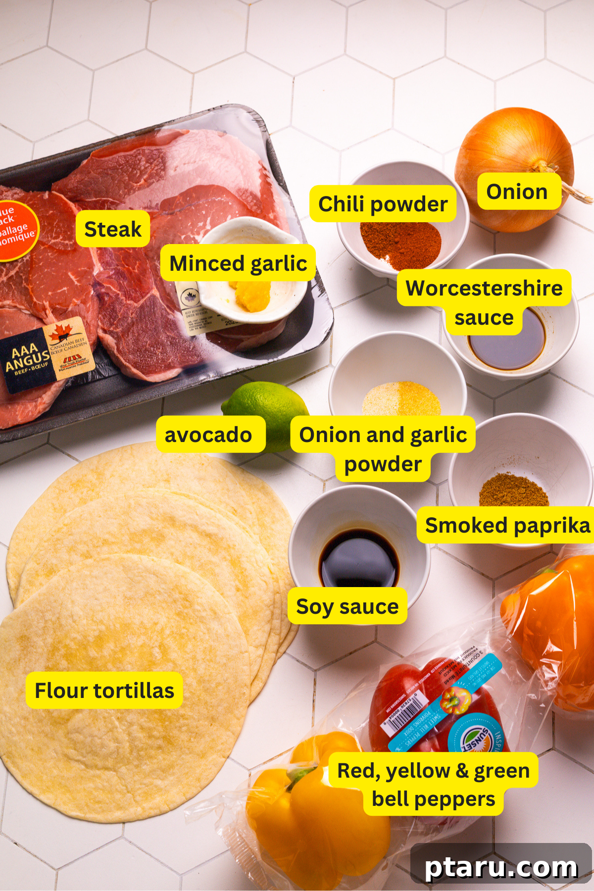 The Ultimate Recipe for Succulent Beef Fajitas 3 Fresh ingredients laid out for beef fajitas including flank steak, red, yellow, green bell peppers, onions, and various spices for the marinade.