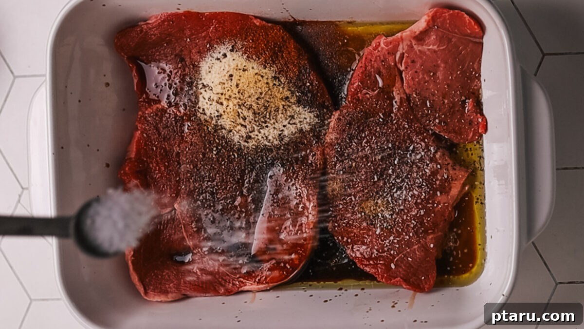 The Ultimate Recipe for Succulent Beef Fajitas 5 Seasoned steak ready for cooking on a clean cutting board.