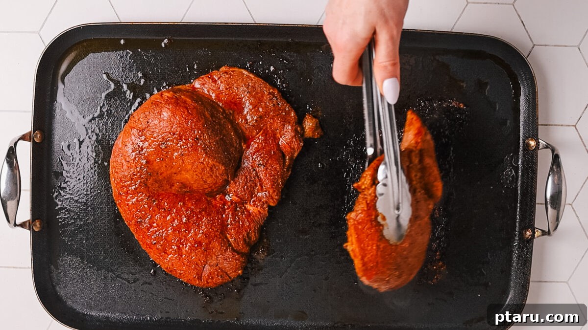 The Ultimate Recipe for Succulent Beef Fajitas 6 Steak sizzling in a hot cast iron skillet, showing the beginning of a beautiful sear.