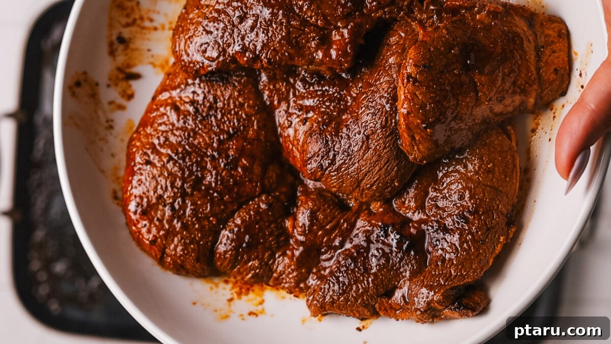 The Ultimate Recipe for Succulent Beef Fajitas 7 Cooked steak resting on a cutting board, preserving its juices before slicing.