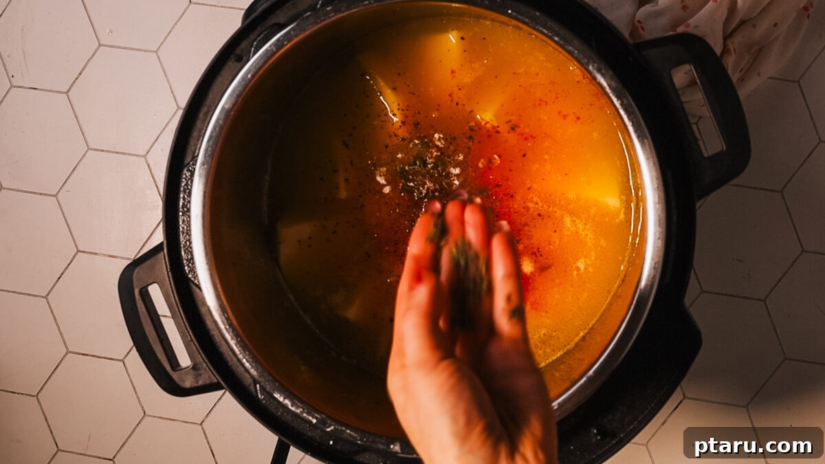 Creamy Instant Pot Potato Soup Ready in Minutes 8 adding seasoning in pot