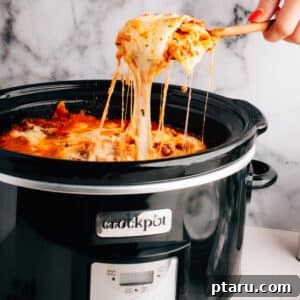 The best crockpot slow cooker lasagna recipe, bubbling with cheese.
