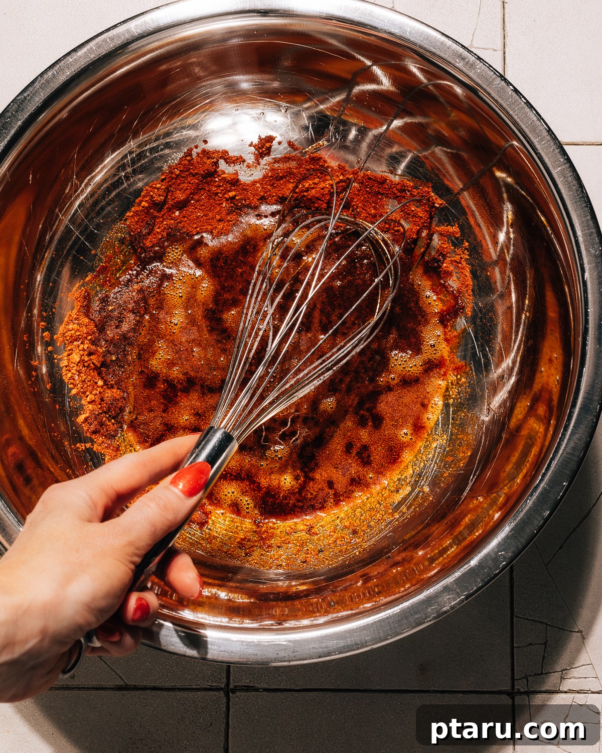 Music City Inferno 5 Step 2: Pour hot oil over the spices, whisking continuously.