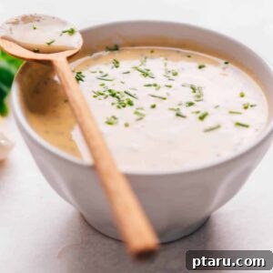 A bowl of lemon tahini dressing ready to be used.