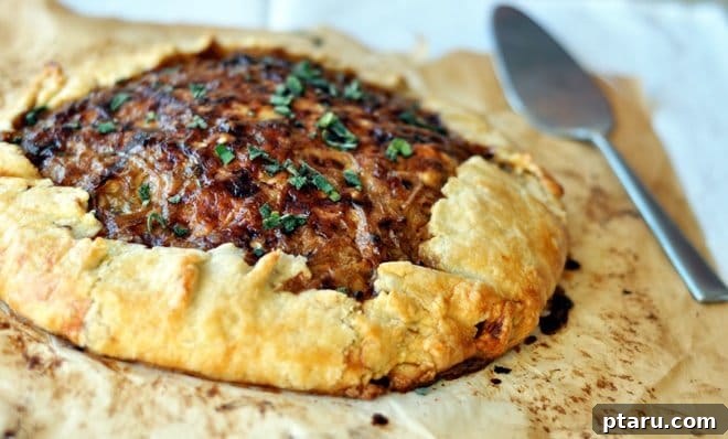 Over 60 Irresistible Recipes for Your Easter Feast 27 Rustic Potato and Caramelized Onion Tart, golden brown and inviting.
