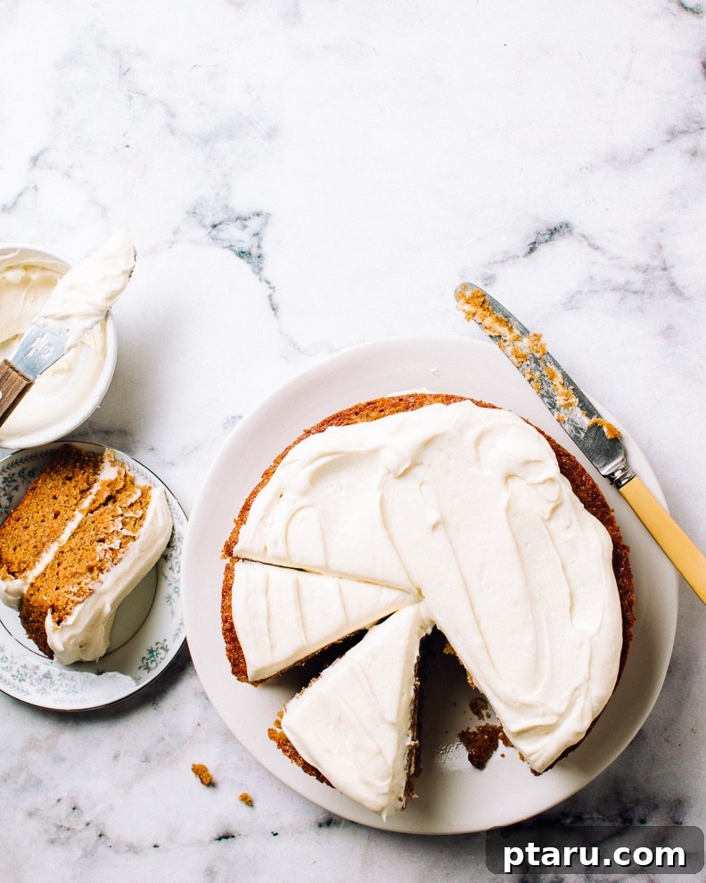 Over 60 Irresistible Recipes for Your Easter Feast 39 Classic Carrot Cake with luscious Cream Cheese Frosting, beautifully garnished.