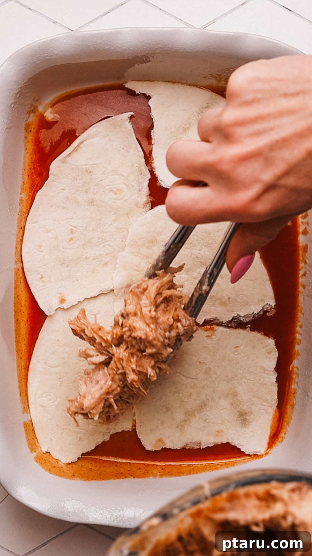 Cheesy Chicken Enchilada Bake 6 Step 3: Layering tortillas, chicken mixture, and cheese in the casserole dish.