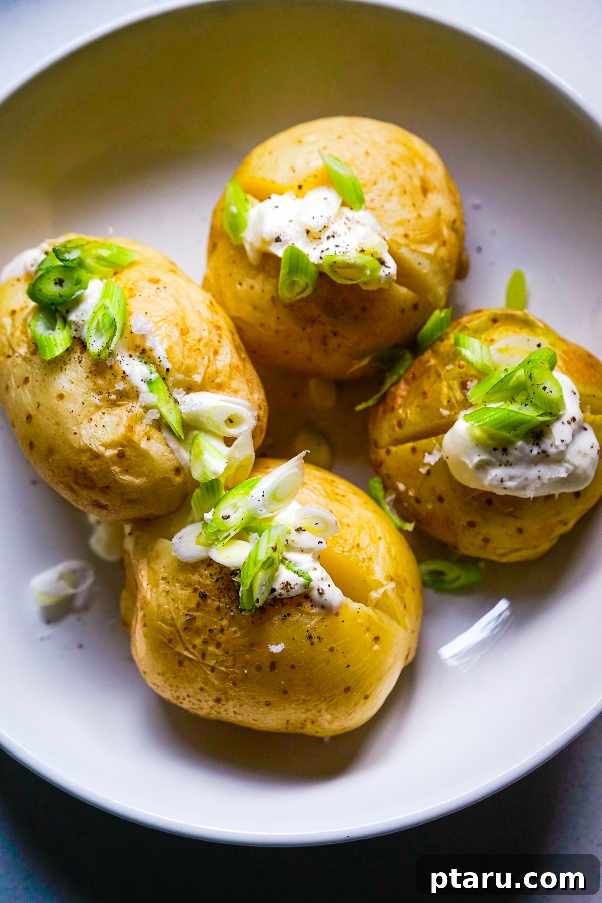 The Secret to Perfect Microwave Baked Potatoes 7 Microwave Baked Potatoes on a plate