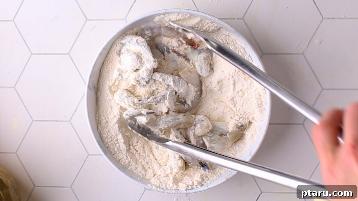 Turn Cooked Shrimp into a Crispy Delight 5 Dredging shrimp in flour as the first step of coating