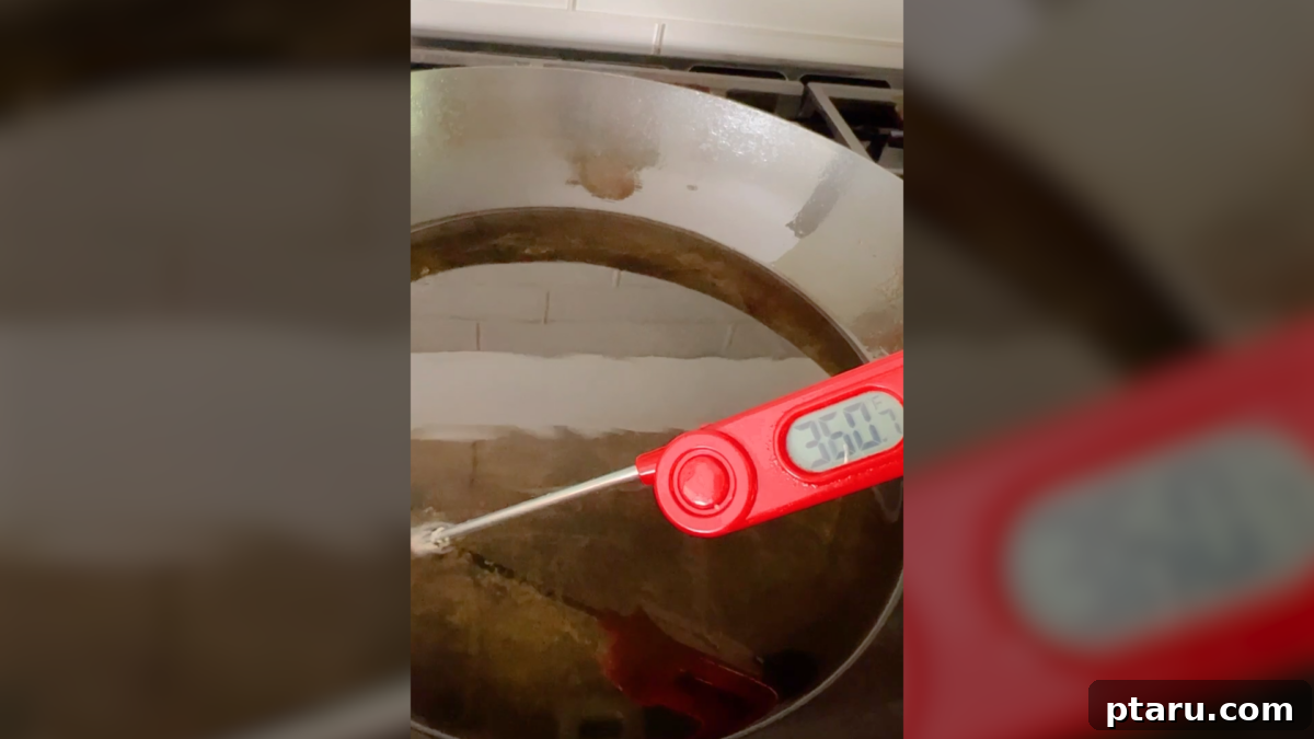 Turn Cooked Shrimp into a Crispy Delight 6 Checking the oil temperature in a skillet with a thermometer