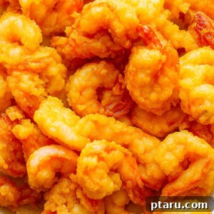 Turn Cooked Shrimp into a Crispy Delight 9 Crispy Fried Cooked Shrimp on a Plate