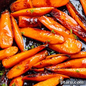 Glistening Sweet Carrots 5 Glazed Carrots close-up photo in a pan.