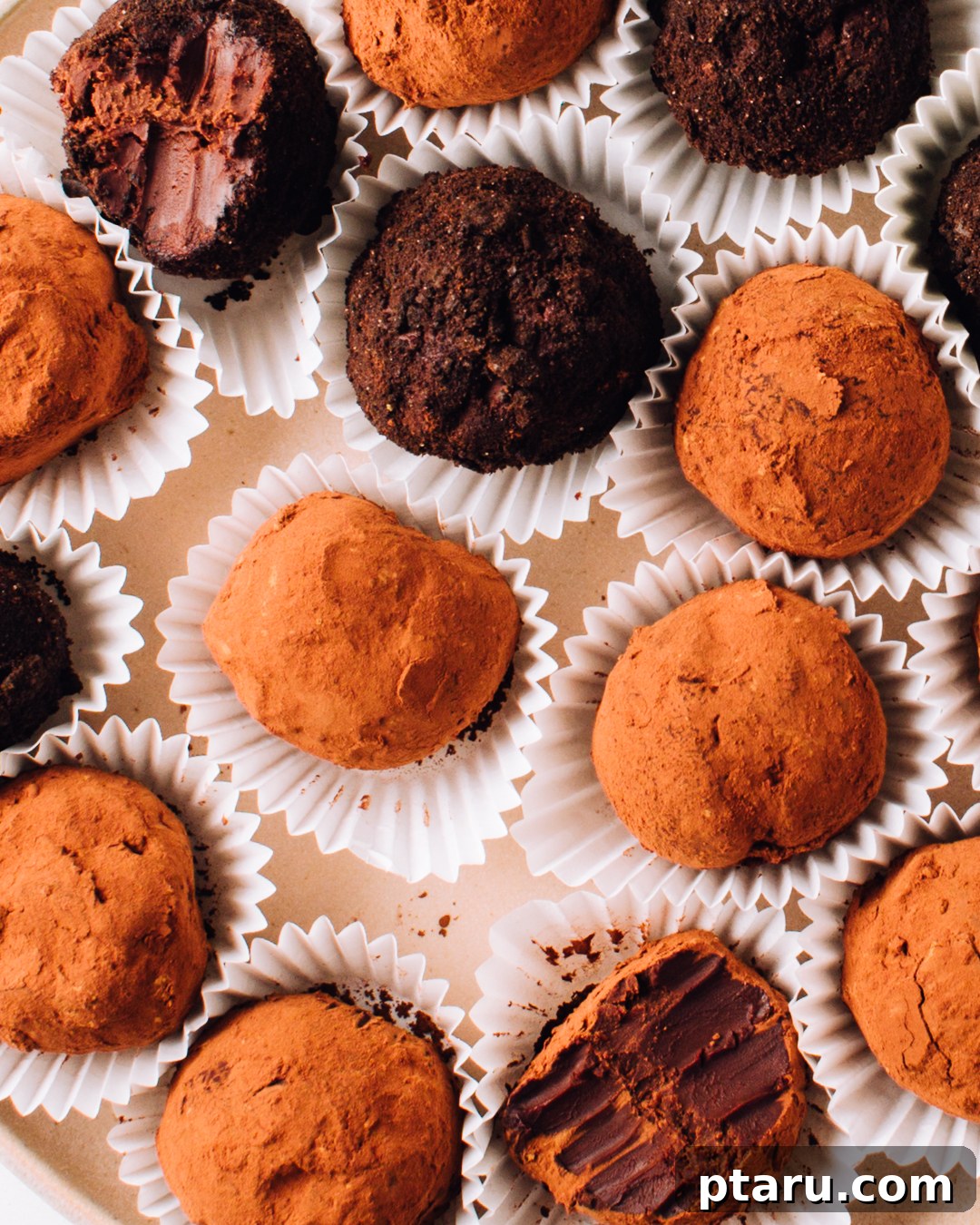 Decadent Three Ingredient Chocolate Truffles 5 Assorted chocolate truffles beautifully arranged on a plate, some with different coatings.