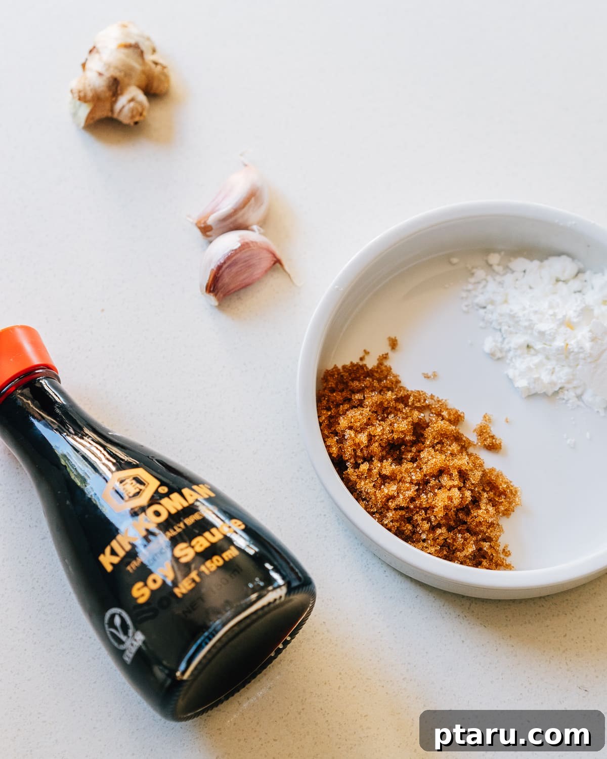 Sweet and Savory Homemade Teriyaki 3 Ingredients for Teriyaki Sauce Recipe laid out on a wooden board.