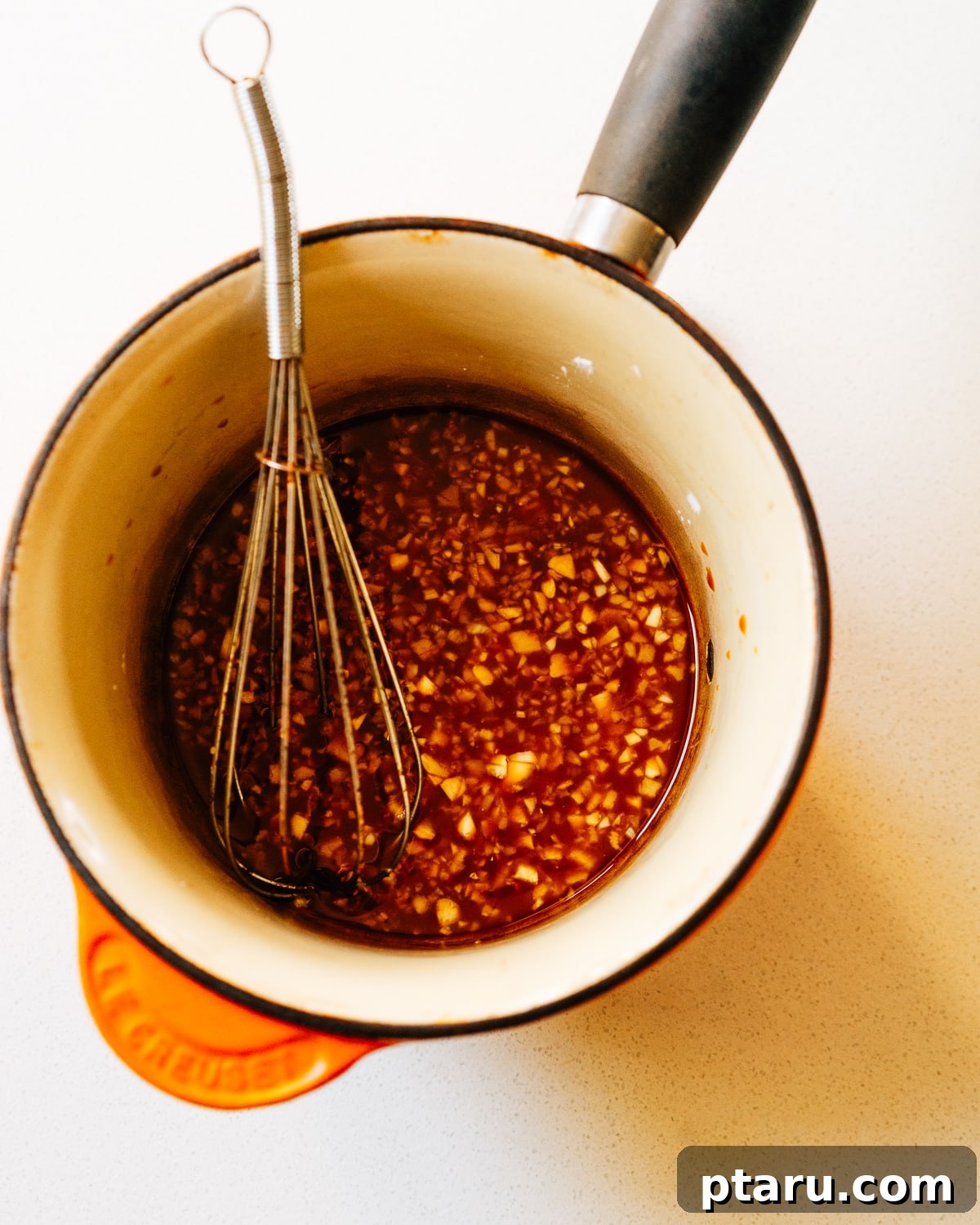 30 Minute Delicious Teriyaki Bowl 4 Step 1: Whisking teriyaki sauce ingredients in a bowl.