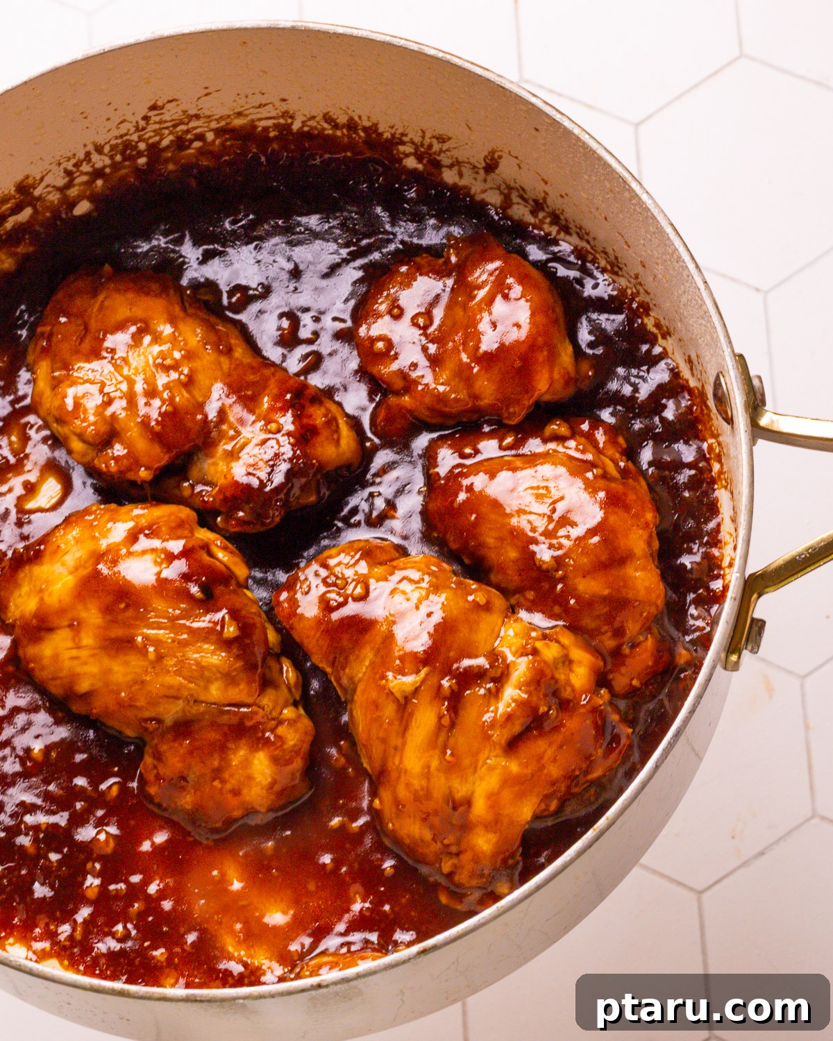 30 Minute Delicious Teriyaki Bowl 5 Step 2: Searing chicken thighs in a hot skillet.
