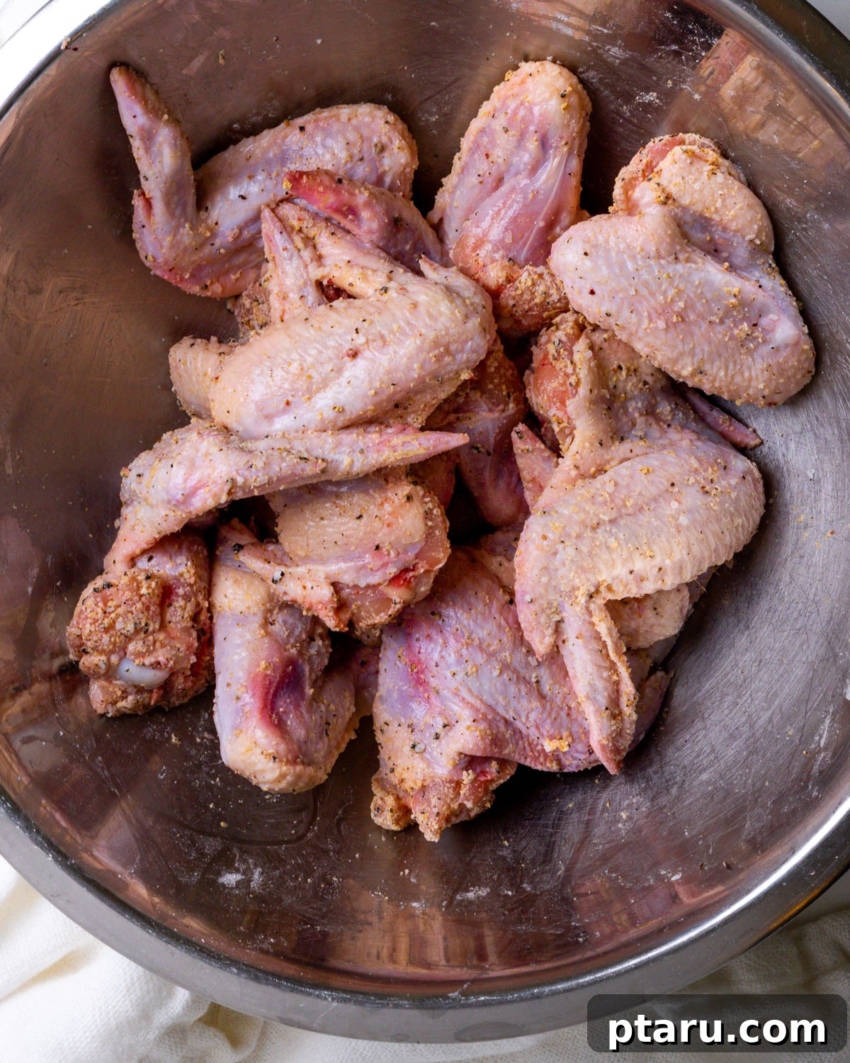 Crispy Garlic Parmesan Wings 4 Parmesan Chicken Wings in bowl with seasoning