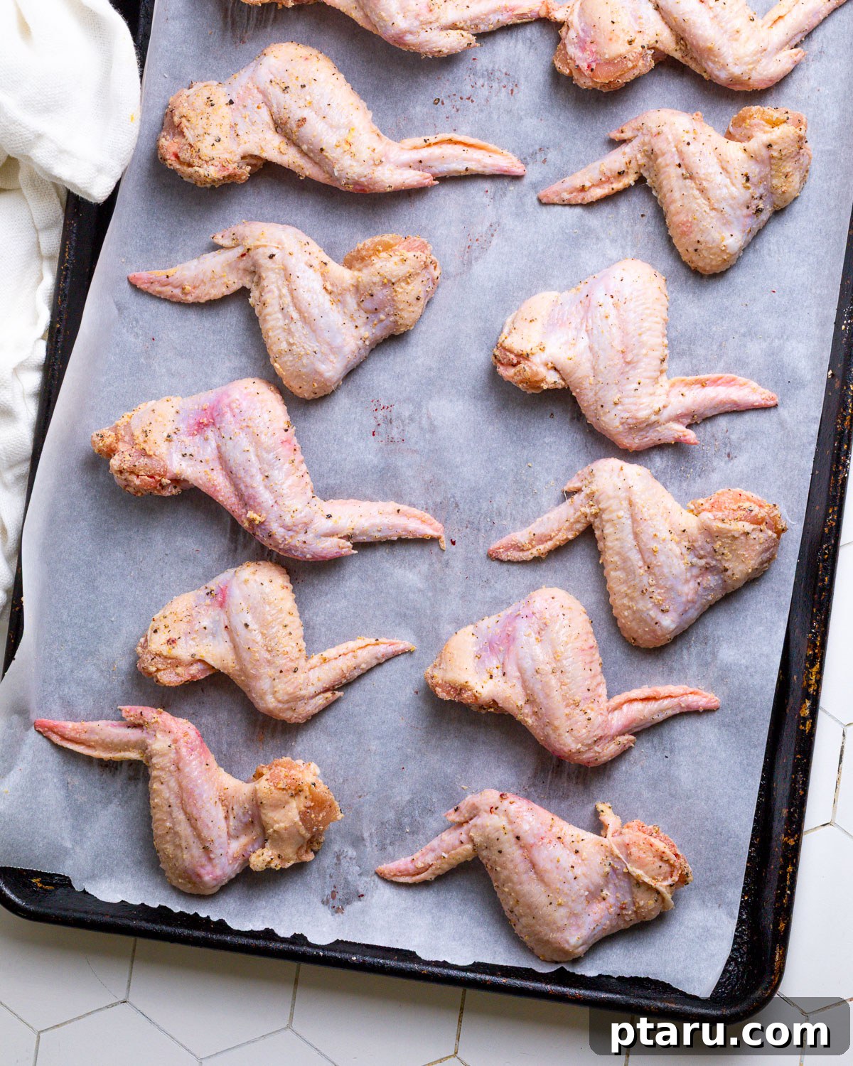 Crispy Garlic Parmesan Wings 5 Parmesan Chicken Wings on baking sheet spaced out