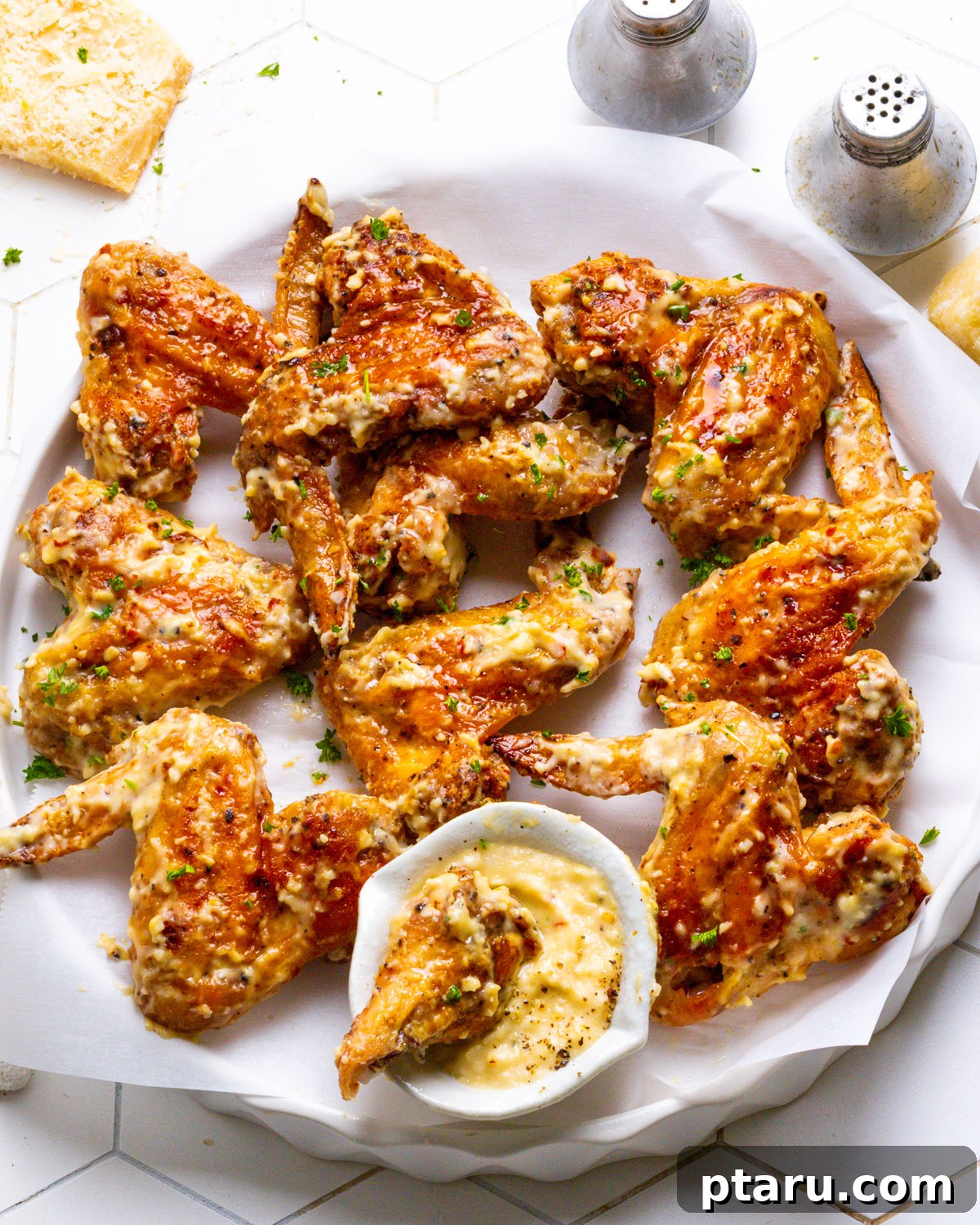Crispy Garlic Parmesan Wings 9 Garlic Parmesan Chicken Wings served on a platter
