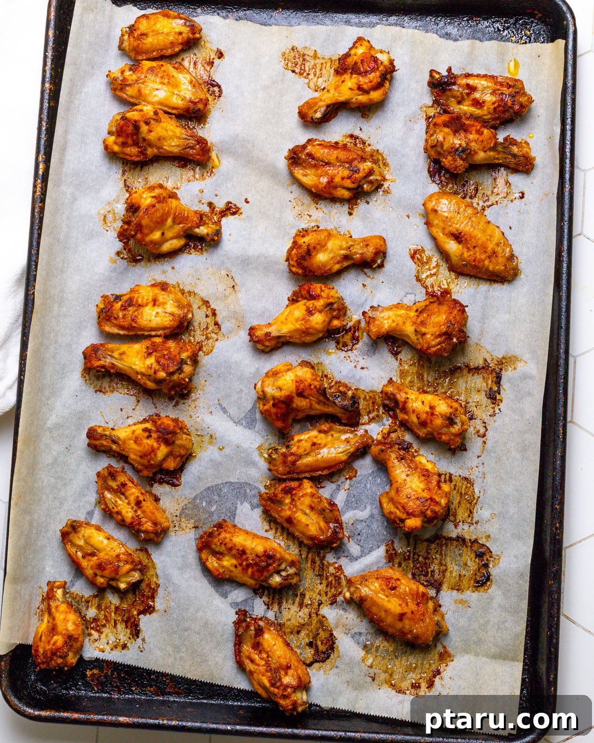 Tropical Fire Wings 5 Crispy baked chicken wings on a tray
