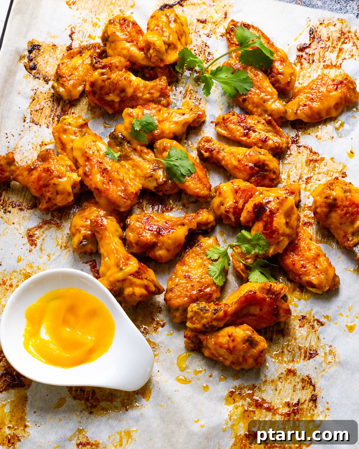Tropical Fire Wings 7 Mango Habanero Wings ready to serve with sauce