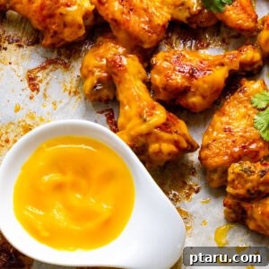 Tropical Fire Wings 8 Mango Habanero Wings with sauce.