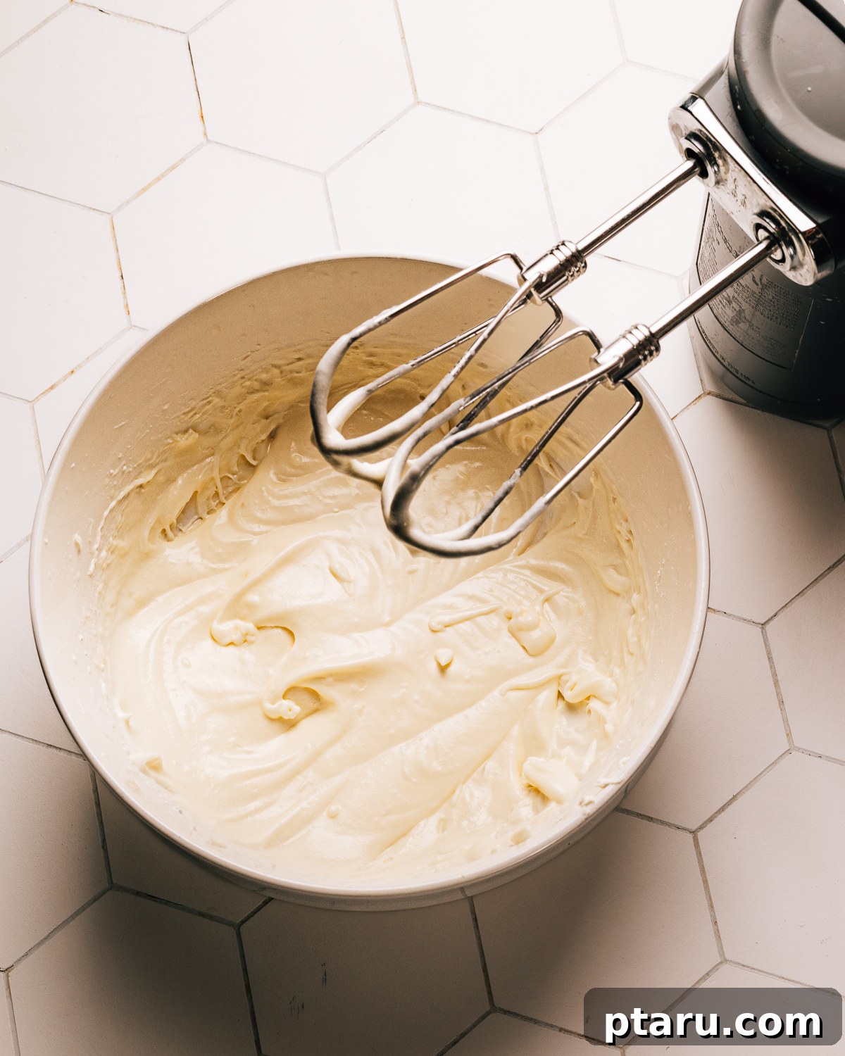 Silky Smooth Cream Cheese Frosting 6 Thinned out cream cheese frosting, ideal for drizzling.