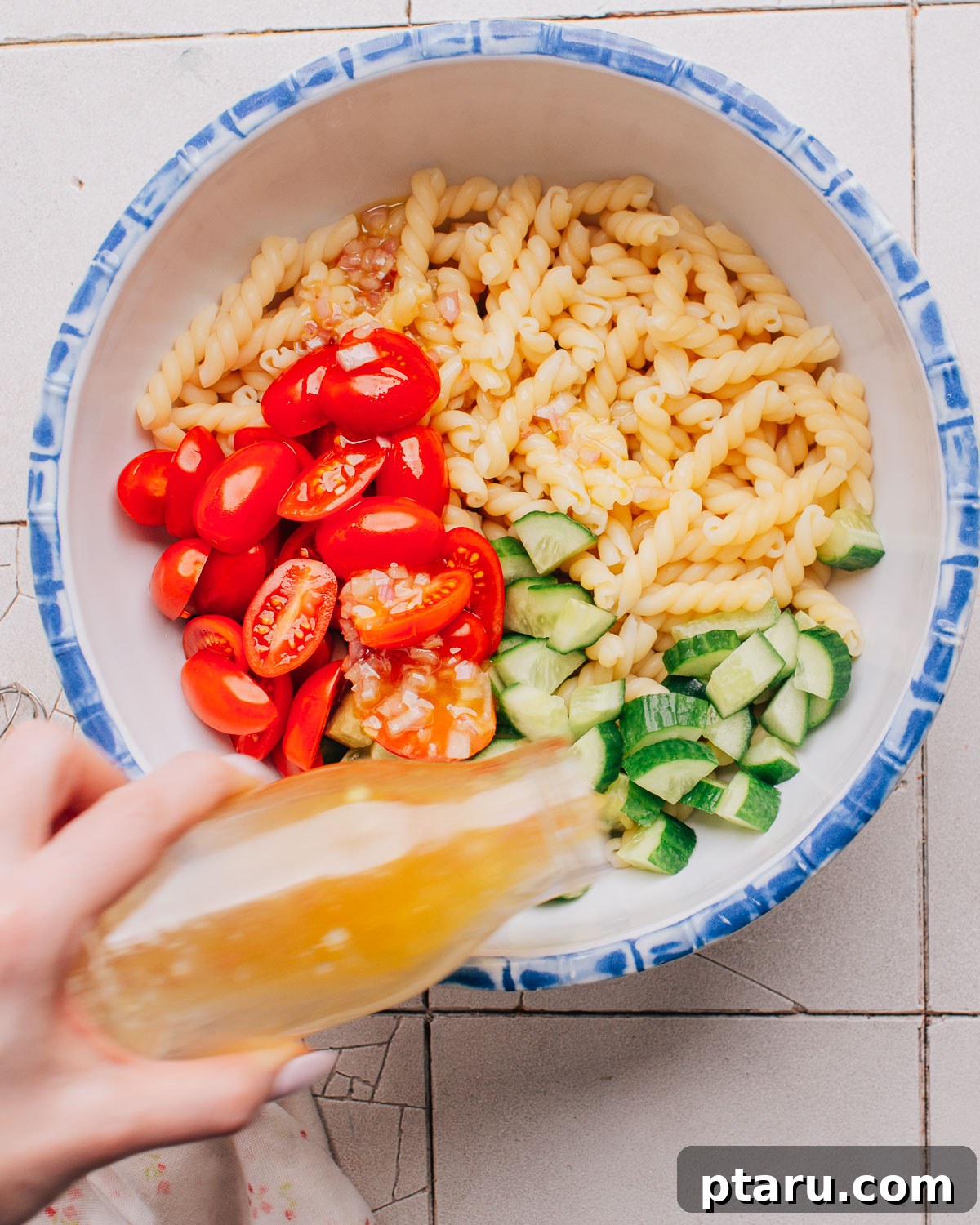 Tuscan Pasta Toss 6 All ingredients for the Italian pasta salad in a large mixing bowl before dressing.