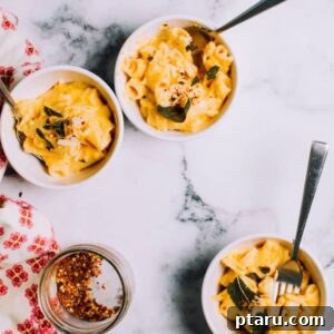 Pumpkin Pasta Sauce recipe on bowls of pasta with sage.