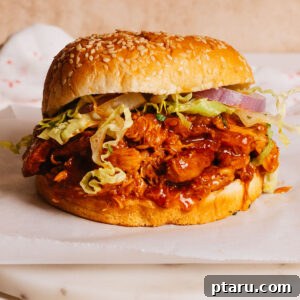 Effortless Slow Cooker BBQ Chicken 11 Crockpot BBQ Chicken in a sandwich.