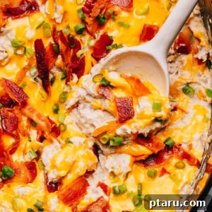 Crack Chicken in slow cooker with a spoon.