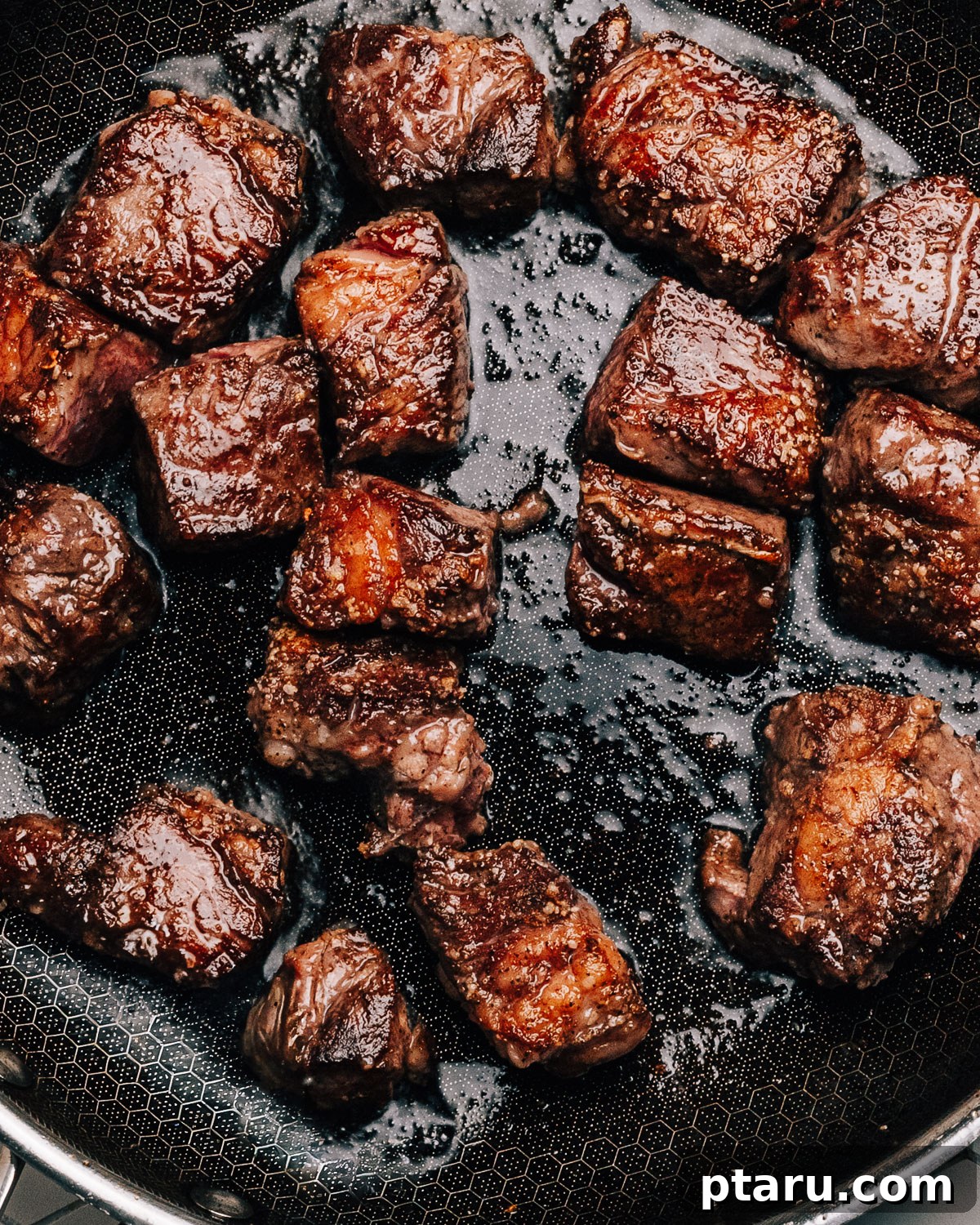 Melt-in-Your-Mouth Slow Cooker Beef Tips and Gravy 4 Step 1: Browning the seasoned beef tips in a hot skillet until a deep crust forms.