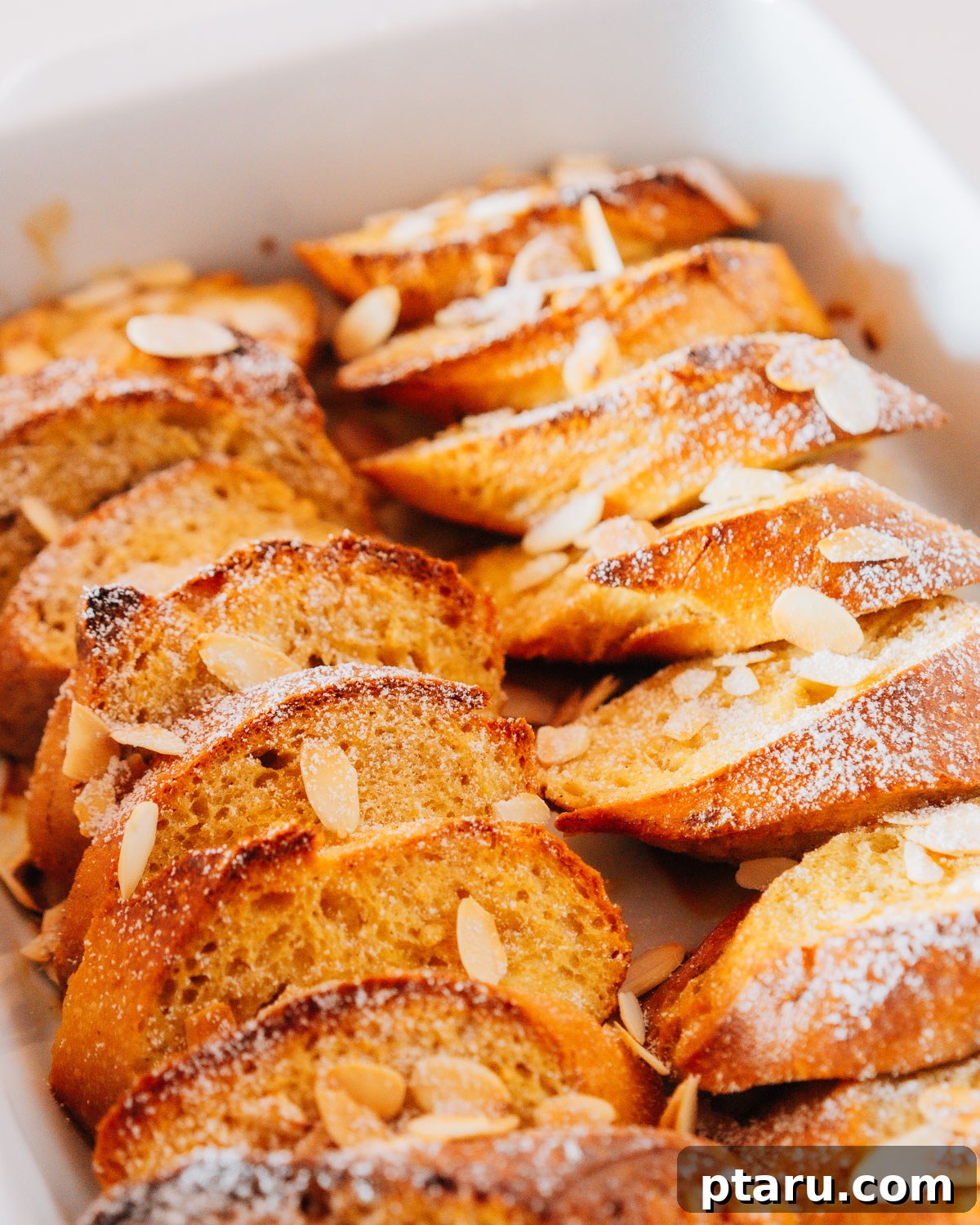 Sunrise French Toast Casserole 6 French Toast Bake served with fresh berries and powdered sugar.