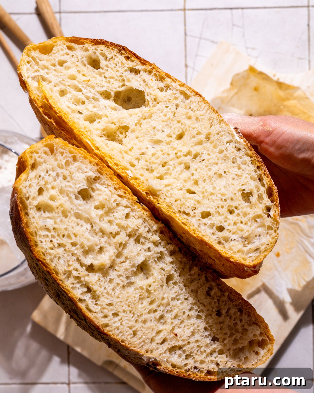 Effortless Artisan Dutch Oven Bread 3 Photo of the interior of a freshly sliced no-knead Dutch oven bread loaf, revealing its airy, tender crumb.