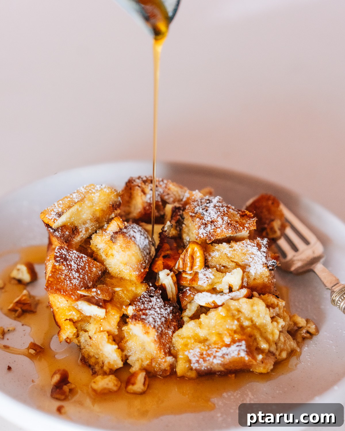 Overnight French Toast Bake for Easy Mornings 2 A beautifully baked French Toast Casserole, golden brown on top, served in a large baking dish.