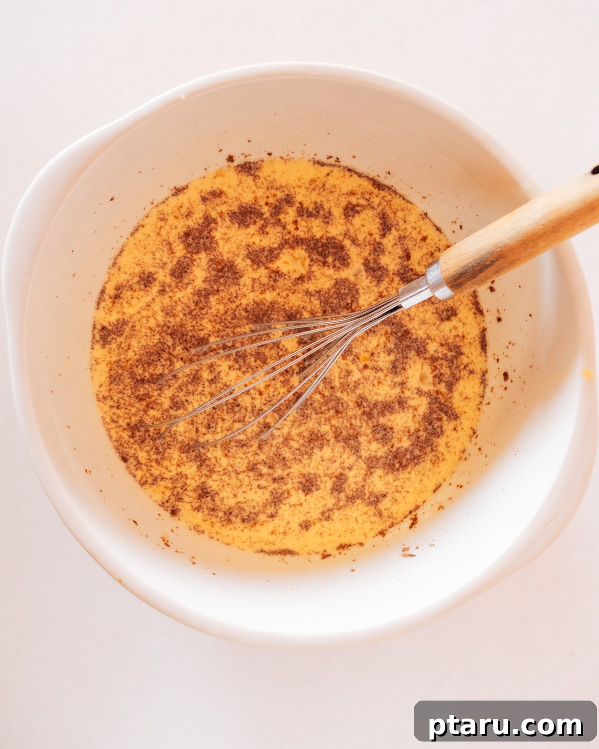 Overnight French Toast Bake for Easy Mornings 4 Step 1: Cubed bread spread evenly in a baking dish.