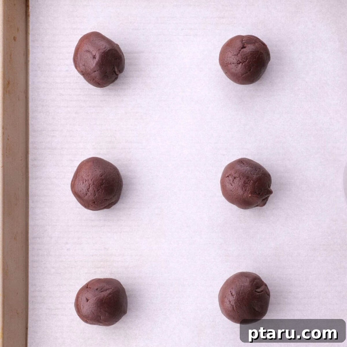 Fudgy Brownie Cookies 4 Scooping brownie cookie dough onto a baking sheet.