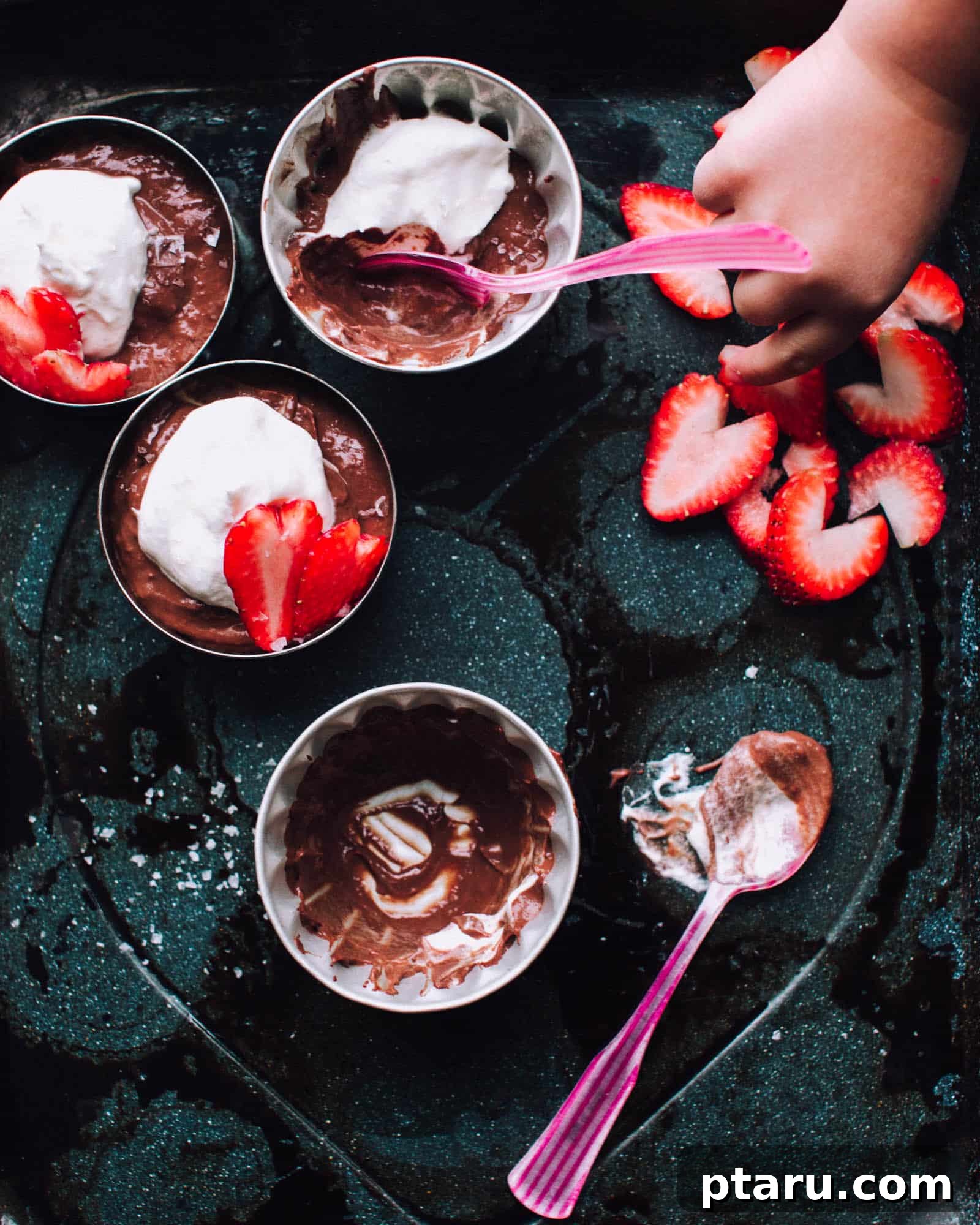 Salted Double Chocolate Delight 4 Individual servings of rich, dark chocolate pudding, elegantly garnished with freshly whipped cream and a sprinkle of flaky sea salt.