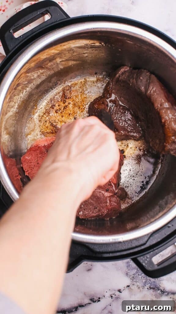 Hearty Instant Pot Beef Barley Soup 5 Adding stewing beef to Instant Pot beef barley soup for pressure cooking