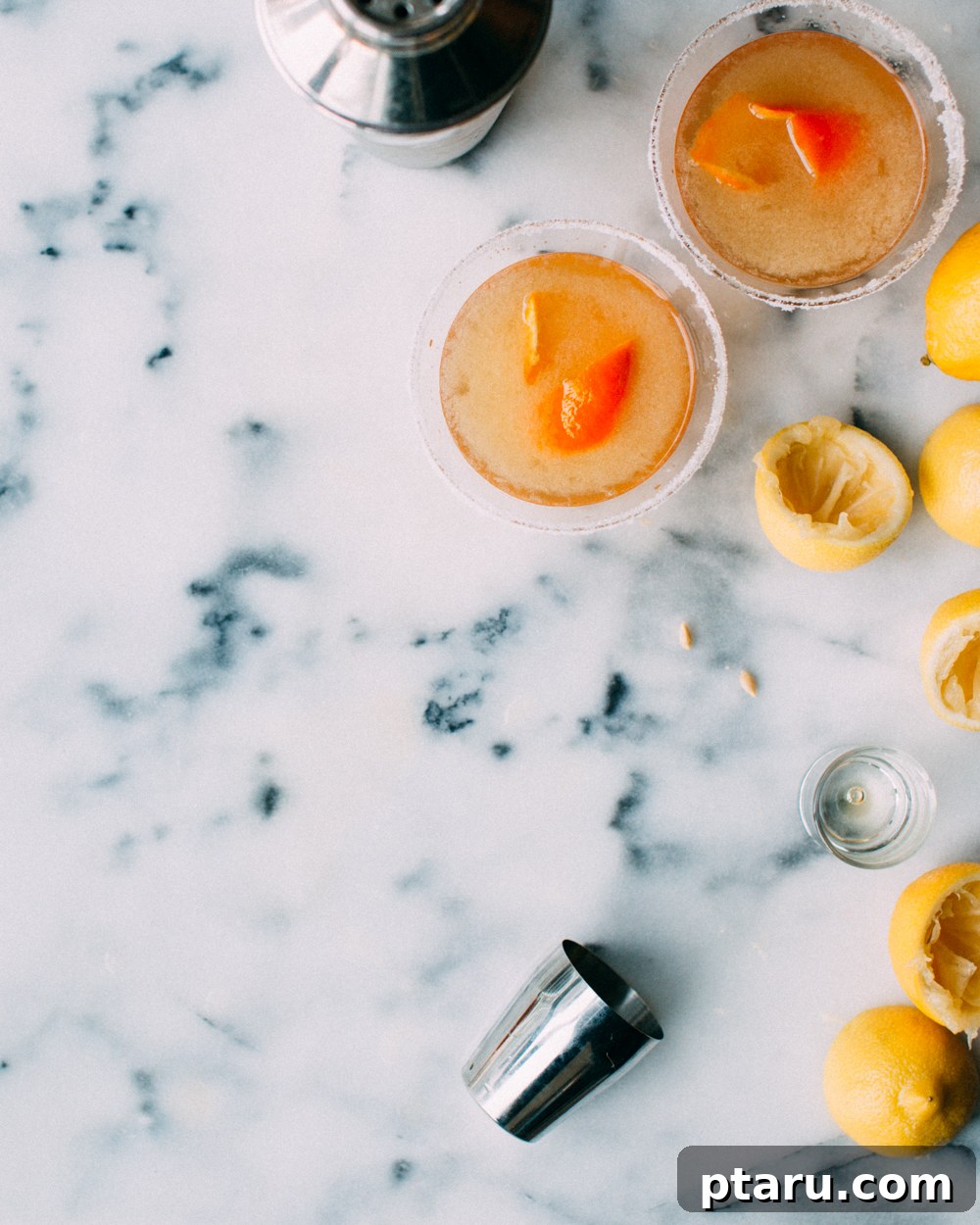 Golden Hour Sidecar 4 Close-up of a Citrus Sidecar Cocktail with an orange peel garnish