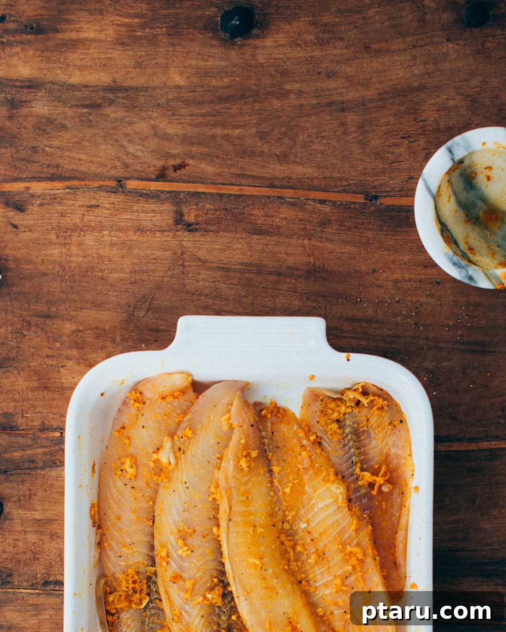 Spicy Kerala Fish Fry 4 Marinating the fish fillets in a vibrant spice paste for an authentic indian fried fish recipe.