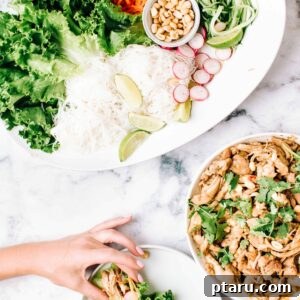 Zesty Asian Chicken Lettuce Bites 3 Asian Pulled Chicken Lettuce Wraps with a vibrant spread of ingredients.