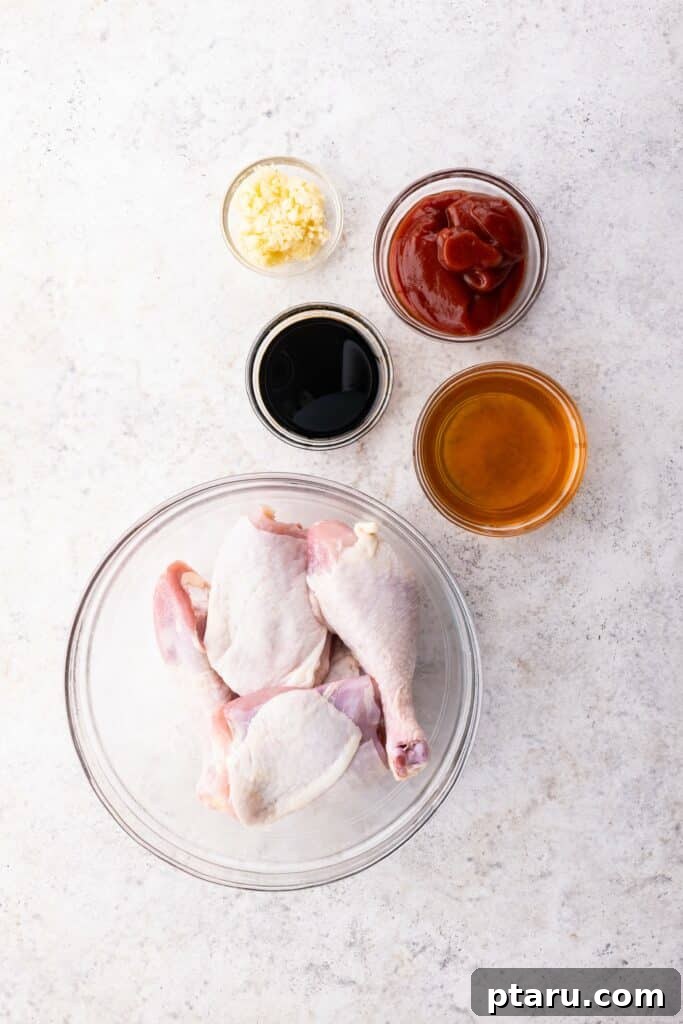 Sticky BBQ Chicken Drumsticks and Thighs 3 Raw ingredients laid out for Oven-Baked BBQ Chicken Legs preparation