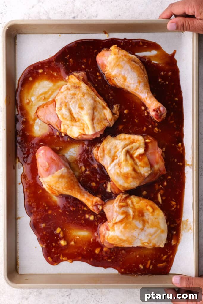 Sticky BBQ Chicken Drumsticks and Thighs 5 Evenly coating the chicken meat with homemade Honey BBQ sauce before baking